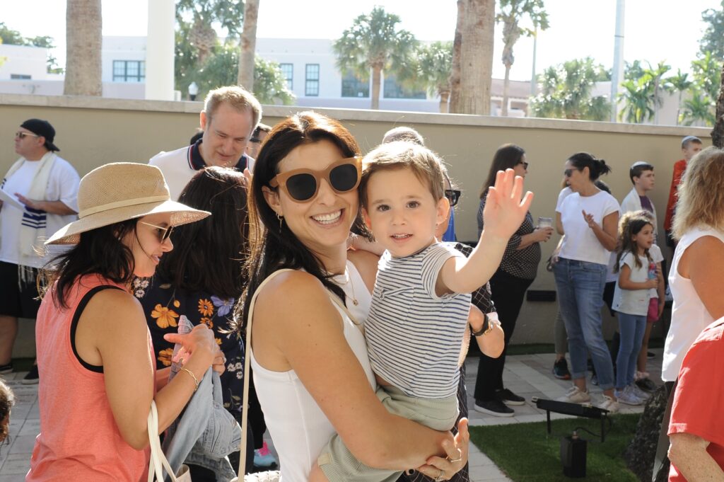 A woman holding a child in her arms.