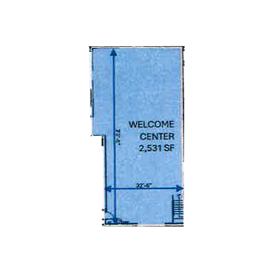 A blue building with the words welcome center on it.