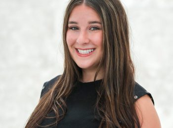 Smiling young woman with long brown hair