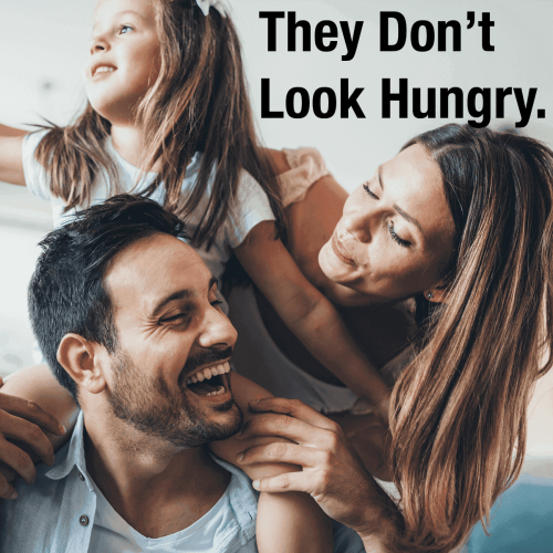 Happy family with playful child, smiling together.